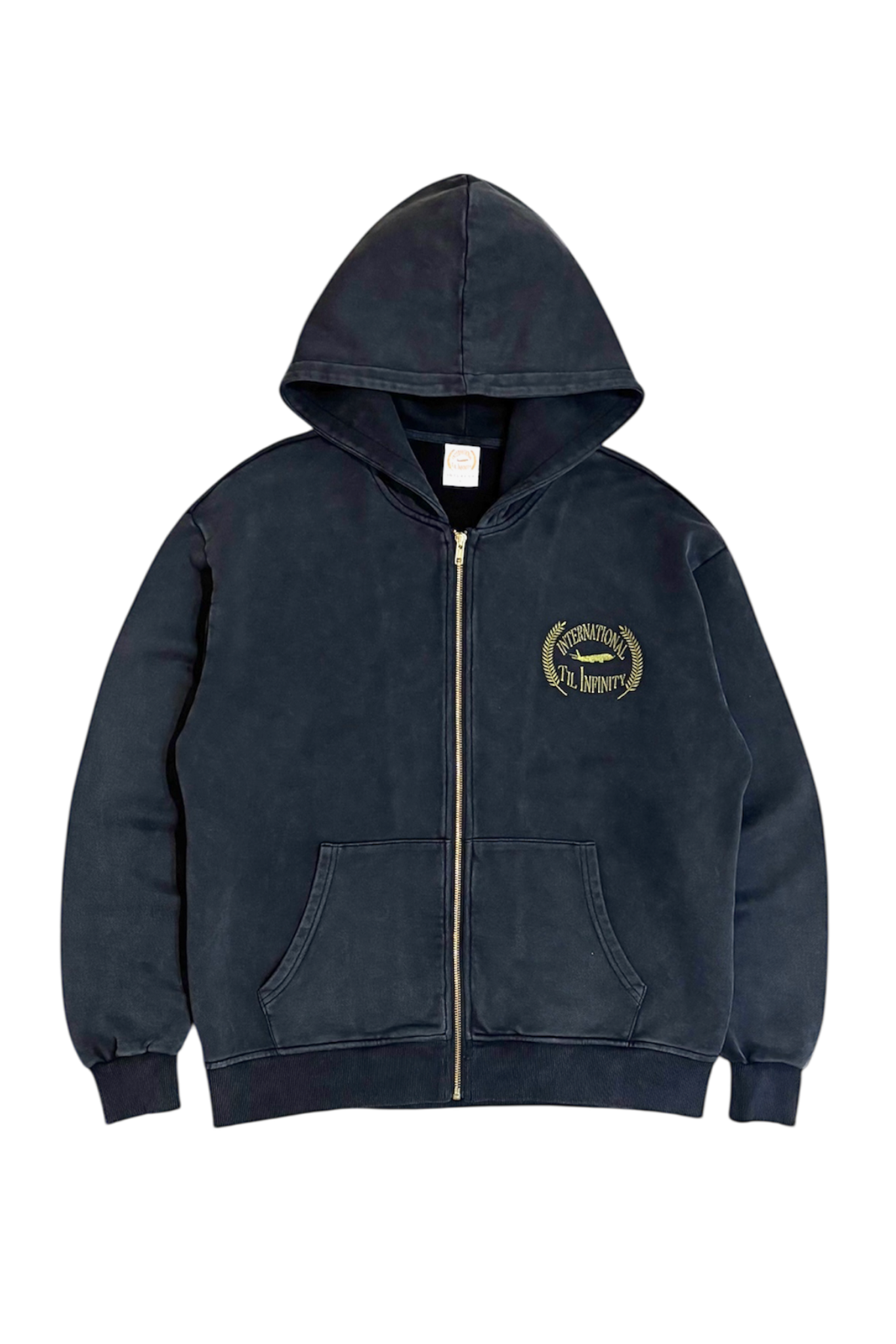 Man and woman wearing INTERNATIONAL TIL INFINITY navy zip hoodies on a fenced city court