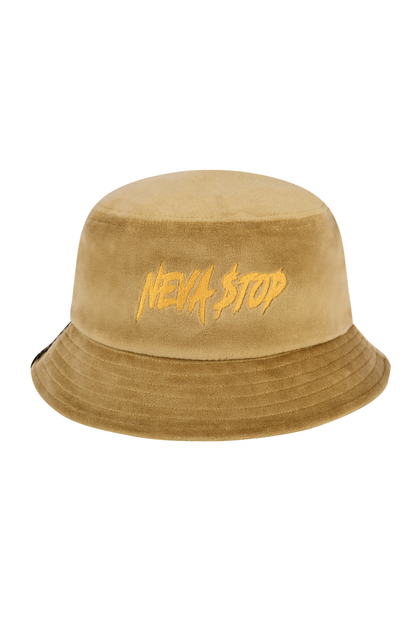 A beige velour bucket hat with the text 'NEVA STOP' embroidered on the front.