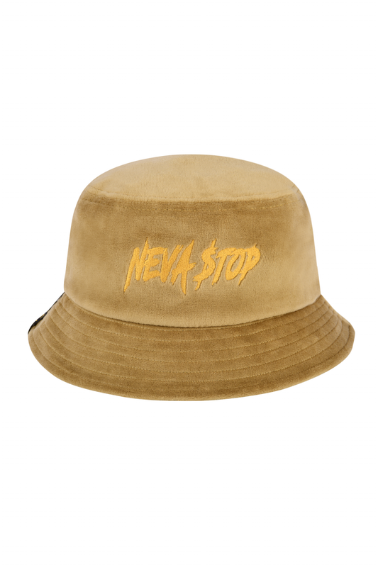 A beige velour bucket hat with the text 'NEVA STOP' embroidered on the front.