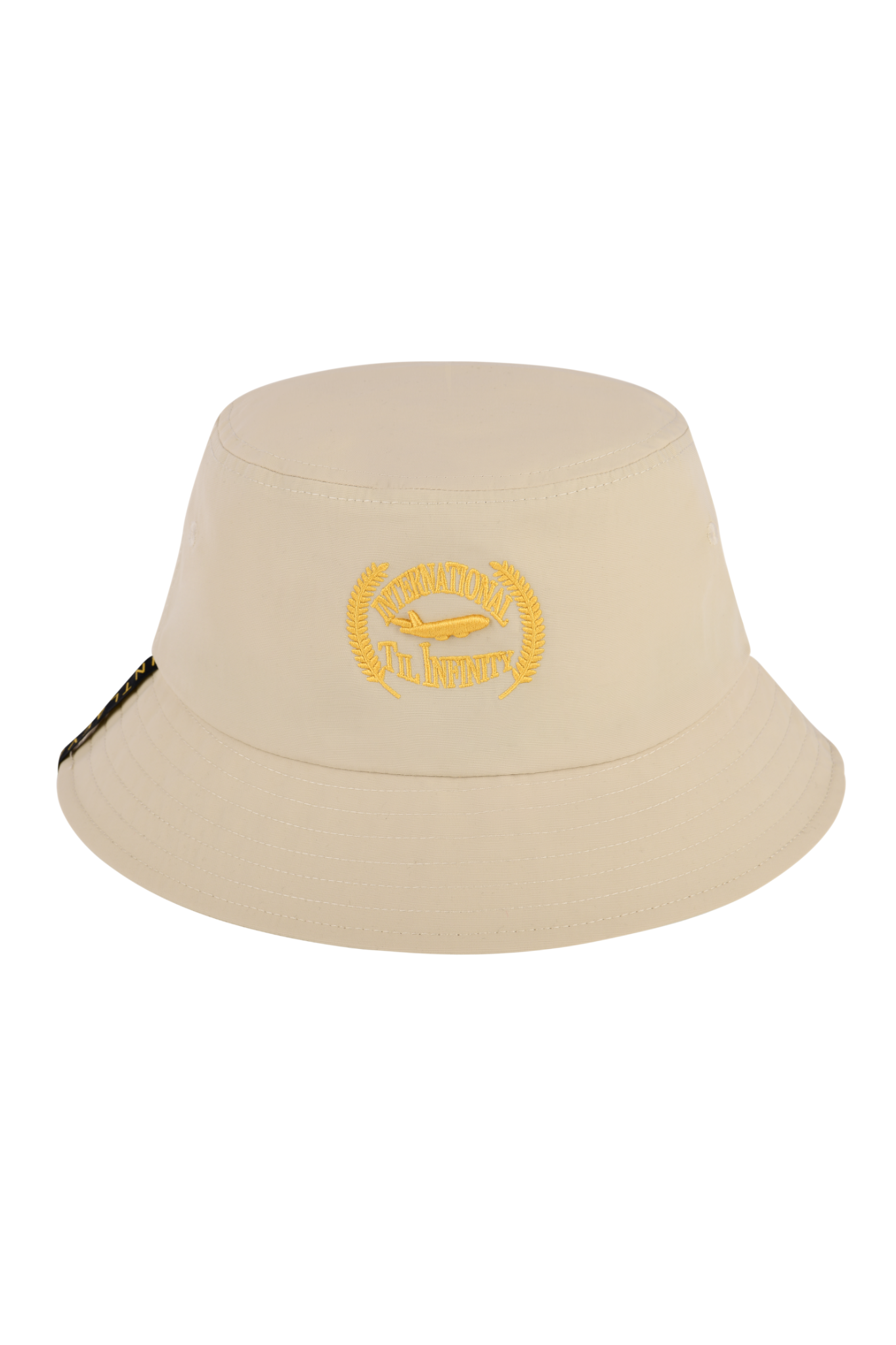 A beige nylon bucket hat with a flat top and the INTERNATIONAL TIL INFINITY logo on the front.